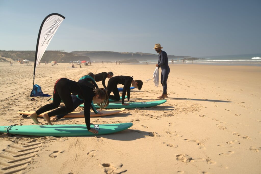 Surf Students on beach using Surf Rentals from Club Vagabond for the class.