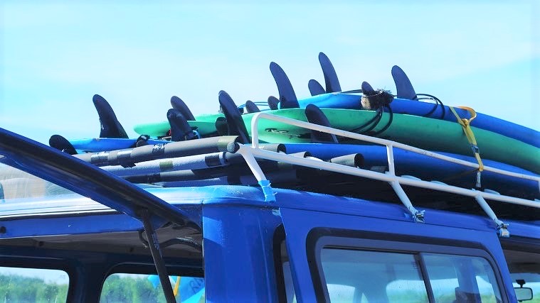 Surfboards to rent on top of Club Vagabond Car